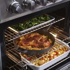 two pans filled with food cooking in an open oven, next to each other