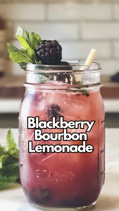 a blackberry bourbon lemonade in a mason jar