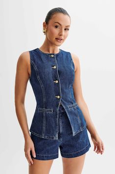 Hands down staple. Presenting the ABEL Denim Button Up Top, a modern essential for your wardrobe rotation. Boasting a round neckline and a convenient centre front button closure, this sleeveless denim button up top offers a versatile and chic aesthetic. The addition of front mock pockets adds a hint of utilitarian flair, while princess seams ensure a flattering silhouette. This longline vest is perfect for layering over various outfits, whether you're going for a relaxed weekend look with the Ab Dark Denim Shorts Outfit, Denim Waistcoat, Looks Jeans, Moda Denim, Denim Suit, Denim Outfits, Gilet Long, Chic Aesthetic, Moda Jeans