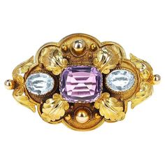 A Victorian Cushion Amethyst and two Oval Topaz stones Brooch made in 18k Gold. There is no gold mark but it has been tested. The weight of the brooch is 11.10 grams. The dimensions are 2 inches x 1.25 inches. Amethyst Dimensions: 13.66 x 12.18 x 6.40 MM. Blue Topaz Dimensions: 9.40 x 7.34 x 3.61 MM. Gold Cushions, Antique Brooches, Amethyst Jewelry, Old Jewelry, Topaz Stone, Antique Jewellery, High Quality Jewelry, Blue Topaz, Antique Jewelry