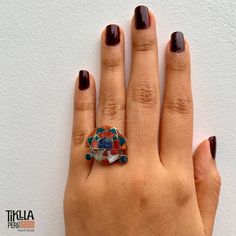 Explore the richness of the Inca legacy with our Tumi Head Ring. Made in 950 silver, this ring is not just a piece of jewelry but also a slice of history. Featuring a 3/4 inch design and weighing approximately 7 grams, this ring is a perfect fusion of cultural heritage and elegance. Product Features: Material: Crafted from 950 silver for a durable and shiny finish. Design: The Tumi head, a symbol of Inca culture, is beautifully represented, highlighting Peruvian art and tradition. Dimensions: Th Round Rings With Inlay Perfect For Gifts, Gift Round Ring With Inlay, Artisan Sterling Silver Ring With Unique Design, Fusion Style Jewelry With Inlay For Gifts, Handmade Sterling Silver Enamel Ring For Anniversary, Handmade Unique Sterling Silver Enamel Ring, Multicolor Hallmarked Rings For Gifts, Bohemian Multi-stone Rings For Gifts, Fusion Style Inlay Jewelry As Gift