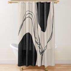 a black and white shower curtain hanging on a wall