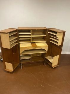 an old fashioned wooden desk with shelves and drawers