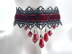 Dear customers, for a price offer of expedited shipping outside of Germany, please contact me directly via Etsy messages. A Gothic Victorian dark red collar with sparkling red crystal drops, bracelet and earrings, made to sparkle with your dress for an exciting event or a casual goth look. Goth fashion is distinguished by darkness, mystery, elegant wardrobe pieces and, smoky makeup even though it may surprise some that not all Goths always wear black. It's said that all Goths have the desire to Handmade Vampire Style Jewelry For Party, Adjustable Red Gothic Jewelry, Handmade Gothic Jewelry For Party, Red Gothic Choker For Festivals, Vampire Style Adjustable Choker As Gift, Adjustable Vampire Style Choker As Gift, Adjustable Vampire Style Choker For Gift, Red Choker For Halloween Party, Red Gothic Jewelry For Party