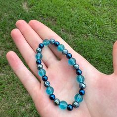 This Is A Cute Clear Shiny Light Blue Glass Beaded Bracelet With Lava Pressed Blue Hematite, And Blue Hematite Beads. This Bracelet Is Simple And Elegant. The Beads Are Very Pretty, Especially In The Sun. This Bracelet Would Go Well With Anything! This Bracelet Is Fitted So It Won't Move Around Much During Wear. Bundles And Reasonable Offers Welcome! Gorgeous, Blue, Light Blue, Shiny, Iridescent, Clear, Glass Beads, Glass, Glass Beaded, Elegant, Casual, Simple, Chic, Cute, Adorable, Coastal, Bea Blue Beaded Stretch Bracelet With Round Beads, Adjustable Blue Stretch Bracelet With Gemstone Beads, Blue Polished Beads Spiritual Stretch Bracelet, Blue Gemstone Beads Stretch Bracelet, Adjustable Blue Gemstone Beads Stretch Bracelet, Spiritual Blue Stretch Bracelet With Polished Beads, Blue Adjustable Stretch Bracelet For Healing, Adjustable Blue Stretch Bracelet For Healing, Blue Gemstone Beads Stretch Bracelet Gift