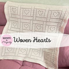 a white crocheted pillow sitting on top of a pink couch with the words woven hearts written across it