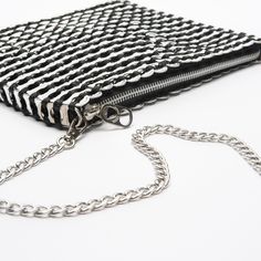 Versatile purse made from up-cycled pop tabs. Converts with leather shoulder strap and detachable hands-free long chain. Beautifully finished with silver fabric liner, custom metal zipper and one inside zipped pocket. 9”W x 7”H x 1” D (expandable). Leather shoulder strap drop: 9” Chain strap length 40", strap drop 20" Hip Pouch, Silver Purse, Pop Tabs, Best Purses, Silver Fabric, Strap Bag, Soda Pop, Brocade Fabric, Small Shoulder Bag