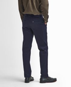 Suede Sateen Tailored Trousers Opt for a clean silhouette with our Barbour Sueded Sateen Tailored Trousers. Offering a great alternative to everyday jeans, this pair fits straight from the hip with a tapered fit below the knee. This sophisticated style is perfect for pairing with shirts and loafers for a contemporary look. Casual Semi-formal Straight Leg Pants, Slim Fit Jeans With Welt Pockets, Work Pants With Five Pockets In Chino Cotton Twill, Casual Slim Fit Dress Pants For Business, Casual Tapered Leg Bottoms For Semi-formal Occasions, Semi-formal Bottoms With Tapered Leg, Classic Slim Fit Bottoms For Fall, Semi-formal Casual Pants With Tapered Leg, Casual Elastane Dress Pants For Business