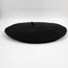 a black piece of material sitting on top of a white surface