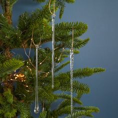 a christmas tree with ornaments hanging from it's branches