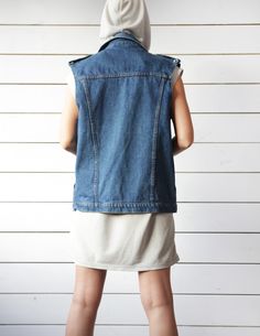 Unisex vintage blue denim sleeveless jacket casual biker style vest. Front button closure, two side pockets, shoulder tabs, no lining. Material is 100% cotton. Made in Britain. Size M on tag. Measured laying flat (please double for circumference): 25'' / 63.5 cm long 20.5'' / 52 cm armpit to armpit 19'' / 48 cm waist Great vintage condition. Casual Light Wash Vest With Pockets, Summer Medium Wash Vest Outerwear, Summer Streetwear Vest With Pockets, Sleeveless Denim Jacket With Pockets For Fall, Casual Medium Wash Vest With Pockets, Casual Vest With Pockets In Medium Wash, Sleeveless Denim Vest With Pockets For Streetwear, Sleeveless Light Wash Outerwear For Summer, Light Wash Sleeveless Summer Outerwear