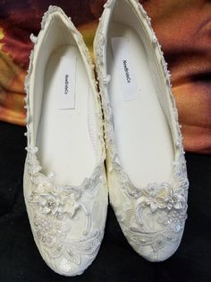 Ivory, or Champagne color lace over satin flat shoes. For more Champagne pictures please go to following link: https://www.etsy.com/listing/285556141/champagne-wedding-flats-shoes-lace? FINAL SALE! THESE SHOES DESIGNS ARE HAND DYED AND EMBELISHED TO ORDER THEREFORE, SHOES CAN NOT BE RETURNED OR EXCHANGED; PLEASE USE MY FEET LENGHT MEASURING GUIDE IN THE ABOVE PICTURE, TO HELP YOU GET THE PROPER SIZE ON THESE PARTICULAR SHOES; I'LL MAKE ALL THE EFFORTS TO HELP YOU HAVE A PLEASANT SHOPPING EXPERIE Flat Heel Lace Wedding Shoes, Lace Flat Heel Wedding Shoes, Lace Flat Heel Wedding Shoes For Ceremony, Lace Flat Wedding Shoes, Lace Wedding Shoes With Flat Heel, Elegant Slip-on Ballet Flats For Wedding, Closed Toe Wedding Shoes With Lace Trim, Lace Wedding Shoes With Round Toe And Lace Trim, Lace Wedding Shoes With Almond Toe For Ceremony