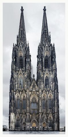 two large cathedrals are shown against a cloudy sky