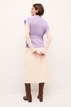 Please note: this item is NOT included in our Holiday Savings Event. Complete your winter look with our stylish new Hampton popover. Designed to pair well with our collection of seasonal dresses and skirts, this slip-on cable knit sweater brings that extra wow factor to the combination of our Chelsea skirt and Corgan turtleneck in Sand. Hampton is pictured here in a dreamy Lavender. -Slip on silhouette with button opening at neck -Cable and novelty stitch detail-Optionla ties sash-25% wool /10% Chic Cable Knit Sweater Vest For Fall, Winter Textured Knit Sweater Vest For Workwear, Chic Cable Knit Sweater Vest For Winter, Spring Workwear Outerwear In Chunky Knit, Spring Workwear Chunky Knit Outerwear, Spring Workwear Outerwear With Chunky Knit, Spring Workwear Textured Knit Sweater Vest, Spring Cable Knit Sweater Vest For Work, Chic Chunky Knit Sweater Vest For Winter