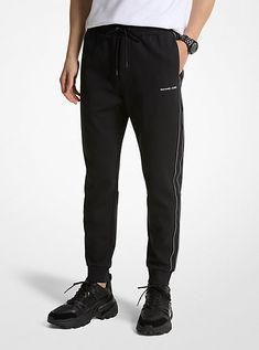 Upgrade your workout wardrobe with joggers that deliver both style and comfort. Finished with logo taping on the sides, they’re fitted with back welt and side pockets for storing on-the-go essentials like your keys and wallet. Wear them to go from lounging at home to running laps around the block. Black Joggers With Logo Waistband For Streetwear, Sporty Joggers With Logo Waistband For Streetwear, Sporty Black Sweatpants With Logo Waistband, Black Sporty Sweatpants With Logo Waistband, Black Athleisure Sweatpants With Logo Detail, Black Sports Sweatpants With Logo Detail, Black Logo Detail Sweatpants For Sports, Black Sweatpants With Logo For Sports, Black Sporty Sweatpants With Logo Detail