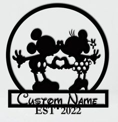 mickey mouse and minnie mouse kissing on each other with the words custom name est 2022