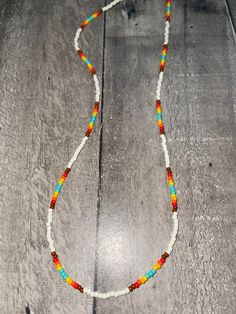 Off white and Aztec sunset pattern seed beaded 16 inch claw clasp necklace/choker White Bohemian Choker With Colorful Beads, Colorful Beaded White Jewelry For Festivals, Adjustable Single Strand White Beads, White Beaded Chain Necklace For Festival, White Bohemian Choker With Beaded Chain, White Bohemian Beaded Chain Choker, Bohemian White Beaded Chain Choker, White Beaded Bohemian Choker, White Jewelry With Colorful Beads For Festival