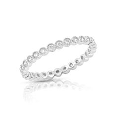 Elevate your jewelry collection with the timeless elegance of the White Gold Over Sterling Silver CZ Dainty Women's Stackable Eternity Band. This exquisite ring is crafted from high-quality rhodium-plated sterling silver, ensuring a lasting shine and exceptional durability. The band, with a delicate width of 2mm, is adorned with sparkling cubic zirconia stones, creating a dazzling display that enhances its sophisticated appeal. Designed for versatility, this eternity band can be worn alone for a Eternity Rings Stackable, Black Gift Boxes, White Gold Band, Eternity Band, The Band, Eternity Bands, Eternity Ring, Rhodium Plated, The White