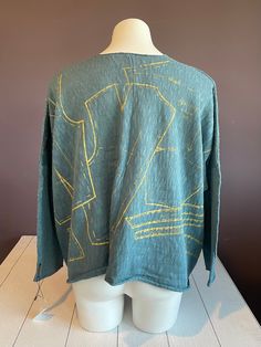 A boxy knit top adorned with a vibrant gold sewing pattern print. Perfect for staying warm and stylish on chilly days. 100% Cotton Hand wash, cold; block and lay flat to dry. Kedem Sasson, Rosé Sister, Magnolia Pearl, Co Design, Sweater Jacket, Stay Warm, Lay Flat, Sewing Pattern, Knit Top