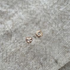 Molten mini rose gold and genuine diamond earrings. Sold both individually as a single stud or as a pair.  Each stud is unique, due to the nature of the  molten gold, and made up from a piece of molten rose gold around 3mm across with a central genuine sparkling brilliant cut 1.5mm white diamond.  These studs are the perfect addition to a curated ear look, easy to layer up with others or to just add some subtle sparkles when worn alone.  They also come in other colours. Please check my shop for Lauren Moore, Molten Gold, Curated Ear, Ear Stack, Mini Roses, Rose Gold Earrings, Gold Studs, Ear Studs, Jewelry Earrings Studs