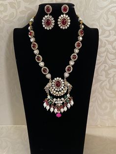 This exquisite Victorian moissanite style ad necklace showcases intricate craftsmanship, blending traditional Indian and Victorian elements. Exquisite Hand Set Pendant Necklace, Traditional Cubic Zirconia Pendant Jewelry, Fusion Necklace With Stone Setting, Festive Cubic Zirconia Necklaces Hand Set, Festive Diamond Pendant Kundan Necklace, Diamond White Ruby Necklace With 17 Jewels, Hand-set Round Diamond Necklace For Festive Occasions, Hand Set Round Diamond Necklace For Festive Occasions, Traditional Round Necklaces With Stone Setting