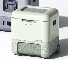 two coolers sitting next to each other in front of a white wall and floor