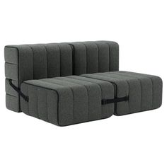 two gray couches sitting next to each other