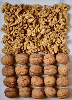 walnuts and other nuts on a white surface