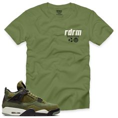 "This Olive 4 Redrum V6 Tee is essential for any urban streetwear enthusiast. Show off your style in this premium 100% cotton tee, featuring a classic fit and green/black/natural short-sleeve design. Inspired by the SE craft \"OLIVE\" 4s 2023. Get your true-to-size Redrum Nation tee today.   (Sneakers not included)." Summer Khaki T-shirt For Streetwear, Khaki Relaxed Fit T-shirt For Streetwear, Graphic Tee For Streetwear In Khaki, Khaki Graphic Tee For Streetwear, Casual Khaki T-shirt For Streetwear, Green Cotton T-shirt For Streetwear, Sporty Khaki Short Sleeve T-shirt, Khaki Cotton T-shirt For Streetwear, Green Urban Cotton T-shirt