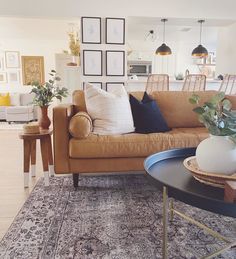 a living room filled with furniture and decor