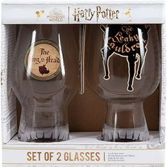 two harry potter glasses in the packaging for each glass, one with an image of a dog on it