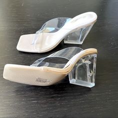 Brand New With Stickers Brand: Mata Style: Heeled Sandals Color: Clear With Nude Footbed Square Toe Squared 3.5” Heel ( Appears To Be Acrylic Or Lucite). Straps Appear To Be A Clear Rubber Bottoms Show They Were Likely Tried On In The Store. Size: 8.5 Formal Clear Sandals With 4-inch Heel, Clear High Heel Sandals For Summer, Transparent High Heel Sandals For Summer, Clear Sandals With Heel Strap And Open Heel, Clear Open Toe Synthetic Heels, Trendy Clear Heels For Summer, Clear High Heel Wedge Sandals For Spring, Summer Sandals With Padded Heel In Clear Color, Spring High Heel Clear Wedge Sandals