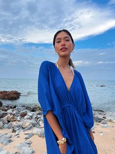 Vacation Wear Edit Blue V-neck Beach Cover-up, Chic Blue V-neck Cover-up, Blue Bohemian Resort Cover-up, Blue Flowy Cover-up For Beach Season, Blue Tunic Cover-up For Spring, Blue V-neck Maxi Dress For Beach Party, Summer V-neck Kaftan For Pool, Blue V-neck Kaftan For Beach Season, Flowy V-neck Kaftan For Day Out