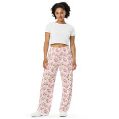 Upgrade your loungewear with our All-Over-Print Unisex Wide-Leg Pants, designed for ultimate comfort and style. These best-selling pants effortlessly blend fashion with function, making them perfect for everything from cozy pajamas to trendy streetwear. Whether you're lounging at home or stepping out, their super soft, stretchy fabric ensures comfort in every move. Crafted with premium knit mid-weight jersey fabric, these pants feature a relaxed unisex fit and an adjustable elastic waistband with a white drawstring for added comfort. Plus, the practical side pockets make them ideal for daily wear. Choose to wear them on the waist or hips for a customizable fit. The fabric's OEKO-TEX 100 standard certification guarantees safe, eco-friendly material that's gentle on the skin. Whether you're Loungewear Pants, Cozy Pajamas, Trendy Streetwear, Pj Pants, Pants With Pockets, Pantalon Large, Rose Flowers, Stretchy Fabric, Jersey Fabric