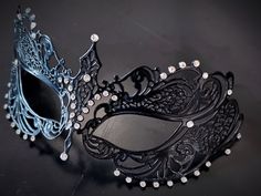 This captivating set includes two stunning masks, both designed in the classic Venetian style. The mask is adorned with sparkling rhinestones, reflecting the light and adding a touch of enchantment to her look while the black mask includes shimmer and exudes strength and sophistication, making him a charismatic presence at any masquerade or other special events.


Age Group/Gender - Adult/Unisex

Size/Type - One size fits all adults

Mask Color - Black
Mask Material - Metal women's, polyresin me Elegant Black Mask For Costume Party, Elegant Silver Evening Masks, Black Eye Mask For Evening Masquerade, Elegant Eye Mask For Masquerade, Elegant Black Masks And Prosthetics For Evening, Black Evening Masks For Halloween, Black Halloween Evening Mask, Elegant Black Masquerade Mask For Halloween, Elegant Silver Masks For Halloween