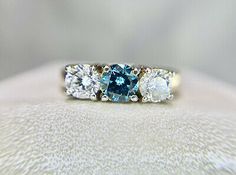 Pinterest Blue Diamond Promise Ring With Accents, Classic Blue Diamond Ring With Brilliant Cut, Blue Round Cut Diamond Ring, Classic Blue Brilliant Cut Diamond Ring, Blue Diamond Ring With Round Cut, Blue Gia Certified Diamond Ring, Gia Certified Blue Diamond Ring, Blue Three Stone Diamond Ring, Blue Three Stone Round Cut Diamond Ring