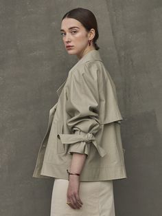 Editor's NotesShort length trench jacket from Maison de Ines. This features a casual and comfortable design wear that is great to style with various of inner wears as a jacket.- Crispy cotton material trench jacket- Half length light weight wear- Light weight cotton material great to style for summer- Ribbon detail on the sleeve- Loose fit silhouette minimal wearMeasurements(in.)One size (xs-m)- Total length: 24.61 in.- Chest: 22.64 in.- Sleeve length: 28.74 in.*Mod Chic Oversized Cotton Outerwear, Modern Spring Utility Jacket For Workwear, Beige Outerwear With Belted Cuffs For Spring, Beige Belted Cuffs Outerwear For Spring, Lapel Collar Utility Jacket For Everyday Spring Wear, Modern Double-breasted Spring Outerwear, Spring Utility Jacket With Lapel Collar For Everyday, Chic Cotton Utility Jacket For Work, Cotton Outerwear With Belted Cuffs For Work