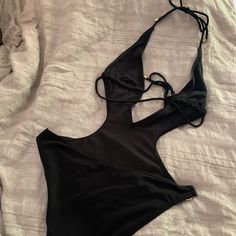 Victoria Secret Brand Swimsuit In Black Size Small Brand New Never Worn Black Halter Neck Bodysuit For Summer, Black Halter Neck Bodysuit For The Beach, Black Halter Neck Bodysuit For Beach, Summer Black Cutout Bodysuit, Black Cutout Swimwear For Summer, Black Triangle Top Bodysuit For Swimming, Black Triangle Top Bodysuit For Vacation, Chic Black One-piece Swimwear, Black Halter Neck Summer Bodysuit