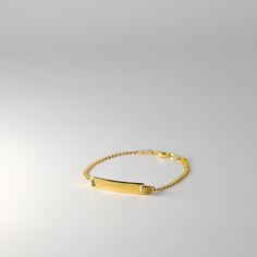 Introducing our exquisite Real 14K Gold ID Bracelet with Cuban Link - a striking blend of modern style and timeless sophistication. This bracelet is a testament to meticulous craftsmanship, not just as a piece of jewelry, but as a symbol of personal identity and enduring elegance. Your Unique Signature: Our Gold ID Bracelet offers a personal touch with an engraved ID tag, allowing you to carry a name, a special date, or a cherished word that holds sentimental value for you. The Cuban Link design Jewellery Wishlist, Unique Signature, Personal Identity, Link Design, Bar Bracelet, Gold Armband, Id Bracelets, Bar Bracelets, Cuban Link Chain