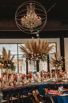 the tables are set up with tall centerpieces