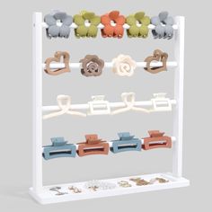 a white rack with several different colored objects on it's sides and two rows of clips attached to each other