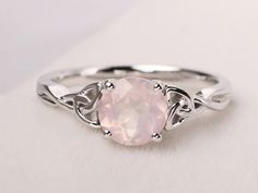 Welcome to my shop, you can find many beautiful gemstone jewelry here, and you also can ask for customized service. Main Stone: Natural pink quartz , round cut 7 mm Accent Stones: None Metal: 925 sterling silver plated with rhodium so as to protect the ring from tarnish and keep it shinning. I also can provide metal options such as 14k solid yellow/white/rose gold Setting: bezel setting more rings: https://www.etsy.com/shop/XCjewelryStudio?ref=hdr_shop_menu It's quite comfortable for wearing and Rose Quartz Wedding Rings, Rose Quartz Heart Ring, Rose Quartz Engagement Ring Silver, Round Rose Quartz Promise Ring, Engagement Rings Celtic, Pink Stone Engagement Rings, Rose Quartz Wedding, Rose Quartz Ring Engagement, Pink Stone Rings