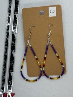 Beaded teardrop with French hooks. Long Drop Teardrop Earrings With Dangling Beads, Beaded Teardrop Dangle Earrings, Teardrop Earrings With Fish Hook, Teardrop Fish Hook Earrings, Purple Teardrop Earrings With Dangling Beads, Colorful Beaded Dangle Teardrop Earrings, Purple Beaded Teardrop Earrings With Ear Wire, Adjustable Beaded Teardrop Earrings, Purple Teardrop Beaded Earrings With Ear Wire