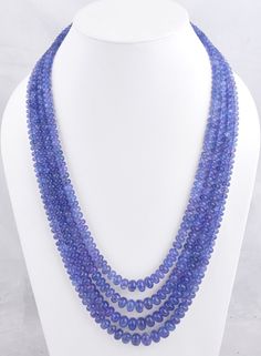 980 CT. 4 Strands Tanzanite Necklace/Layering Necklace/Gemstone Necklace/Beaded Necklace/Gift For Her/Birthstone Necklace/Women Necklace Measurement Specification- Size- 5-12mm Approx. Gemstone- Natural Tanzanite Shape- Rondelle Quality- AA Weight- 980 Ct. Cut- Smooth Drill- Center Color- Blue Length- 16 Inches Shortest Length                18 Inches Longest Length 980 CT. 4 Strands Tanzanite Necklace is a luxurious and captivating piece of jewelry, perfect for commemorating special occasions like anniversaries or as a thoughtful birthstone necklace for her. Crafted with meticulous attention to detail, this necklace features four strands of exquisite tanzanite gemstone beads, creating a stunning and dynamic layered effect. Tanzanite is a rare and highly prized gemstone known for its mesme Tanzanite Necklace, Stone Beaded Necklace, Gemstone Beaded Necklace, Necklace Layering, Tanzanite Gemstone, Blue Tanzanite, Women Necklace, Necklace Beaded, Natural Tanzanite