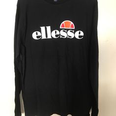 Ellesse Grazie Logo Long Sleeve Size L T-Shirt Retro Sports Print Em07406-001 Condition: New With Tags Size: Large And Xl Style: Em07406-001 Color-Way: Black Black Logo Print T-shirt For Fall, Black Long Sleeve Shirt With Screen Print, Casual Crew Neck Top With Logo Print, Casual Long Sleeve Tops With Logo Print, Relaxed Fit Long Sleeve Tops With Logo Print, Graphic Tee With Logo Print Long Sleeve, Long Sleeve Graphic Tee With Logo Print, Branded Long Sleeve Tops For Streetwear, Black Long Sleeve Tops With Screen Print