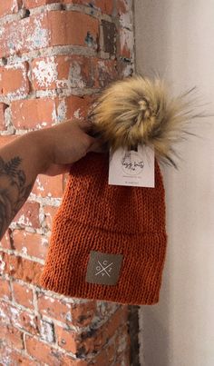 Cozy Collection Stay warm in this soft hat this winter. Knit hat with faux fur pom  C o z y logo 🤍 Color: Pumpkin Spice Trendy Winter Bonnet For Cold Weather, Warm Beanie One Size For Fall, Warm One-size Beanie For Fall, Warm One Size Beanie For Fall, Trendy Winter Hat, One Size Fits Most, One Size Hats For Cold Weather In Fall, One Size Winter Beanie For Fall, Trendy Winter Hat - One Size Fits Most, Winter Beanie Hat With Faux Fur Lining