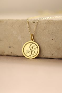 Gold Moon And Sun Pendant - Moon And Sun Gold Necklace ● Material of pendant: Solid Gold 14k ( REAL GOLD ) ● Metal Stamp: 14k ( REAL GOLD ) ● The pendant is available in 5 sizes: - 12,7 mm / 0.5 inches (Diameter) - 14,0 mm / 0,55 inches ( Diameter ) In the photos - 15,3 mm / 0.6 inches ( Diameter ) - 16,5 mm / 0,65 inches ( Diameter ) - 19,1 mm / 0,75 inches ( Diameter ) ( In the photos the size is 14mm / 0.55 inches Diameter ) ( Jump Ring inner diameter: 4 mm ) ● Material of chain: Solid gold 14k ( REAL GOLD ) It is thin and dainty and it is available in 4 sizes: - 40 cm / 15,75 inches ( Length ) - 45 cm / 17,72 inches ( Length ) In the photos - 50 cm / 19,68 inches ( Length ) - 55 cm / 21,65 inches ( Length ) ● Backside engraving is FREE ( Please use the personalization box for that.) ● Sun Moon Pendant, Gold Moon-shaped Engraved Necklace, Gold Half Moon Jewelry For Anniversary, Celestial Half Moon Gold Jewelry, Gold Plated Moon Phase Jewelry, 14k Gold Jewelry With Moon Phase Detail, Gold Half Moon Jewelry With Moon Phase Detail, Silver Half Moon 14k Gold Jewelry, 14k Yellow Gold Moon Necklace