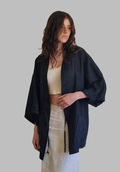 Loose Haori Kimono The fabric of this kimono jacket is 100% quality linen, it is very pleasant to wear over a basic outfit. This jacket adapts to all situations, it gives you both a casual look for an outing with friends (jeans, sneakers, etc.) and a classy and neat style for a night out. Side pocket Tie on the front Black color Unisex Unique size Belt sold separately for €30 Website https://www.a=liberti.com Black Linen Relaxed Fit Outerwear, Casual Linen Kimono With Kimono Sleeves, Casual Linen Beach Outerwear, Linen Kimono With Relaxed Fit, Black Relaxed Fit Kimono For Spring, Black Relaxed Fit Kimono With Kimono Sleeves, Black Kimono With Relaxed Fit, Kimono Jeans Outfit, Haori Outfit