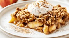 a white plate topped with apple crisp and ice cream