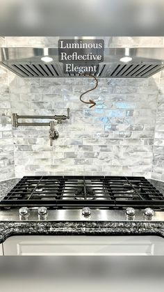 a stove top oven sitting inside of a kitchen next to a wall mounted faucet